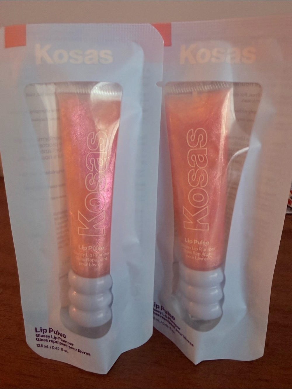 Kosas Lip Pulse Glossy Lip Plumper - Iridescent Peach Pink